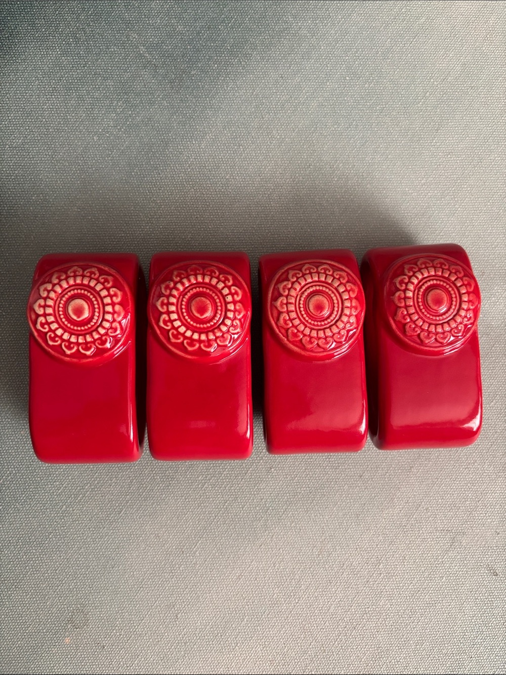 Vintage MCM Red Ceramic Napkin Rings with Decorative Medallion Set of 4